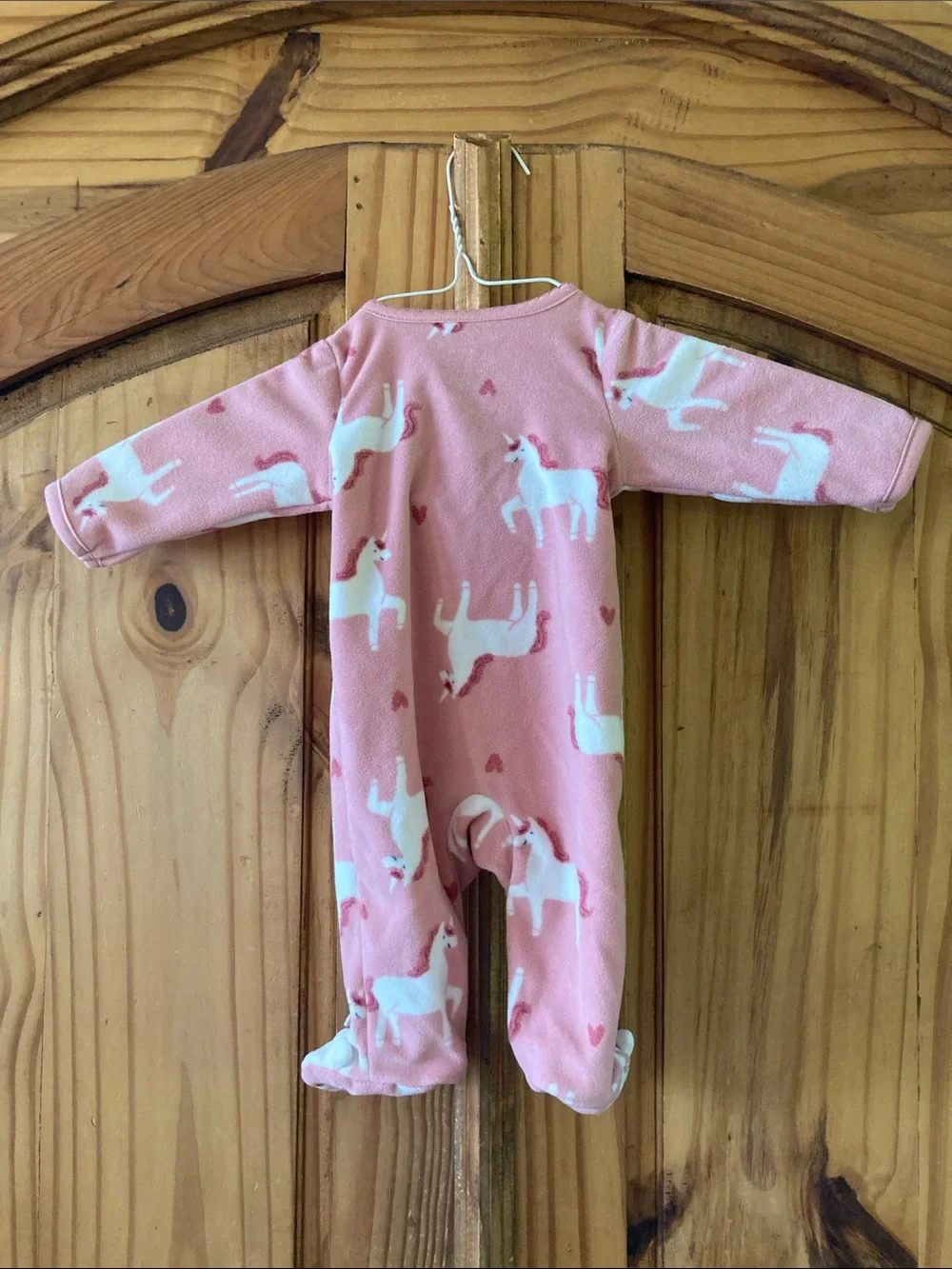 Girls Carter’s pink unicorn footed pajamas size newborn